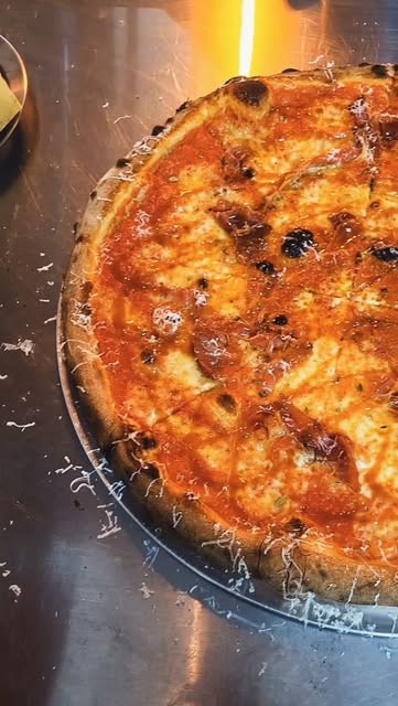 Close up of a charred New York style pizza